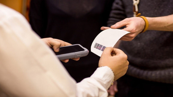 Guests scanning QR tickets at entry gate